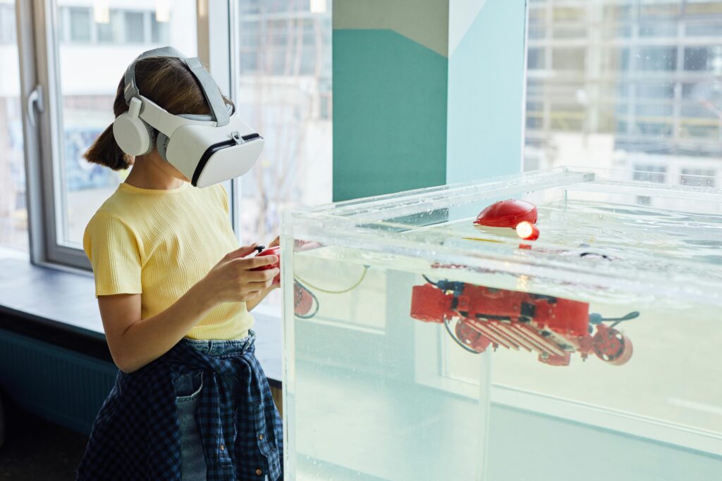 A girl operating a machine via virtual reality